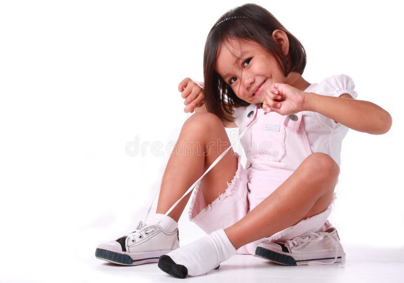 Little Girl Making a Tie on Her Shoe Stock Image Image of pretty