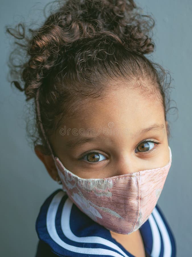 A little girl with a mask stock photo. Image of little - 191468706