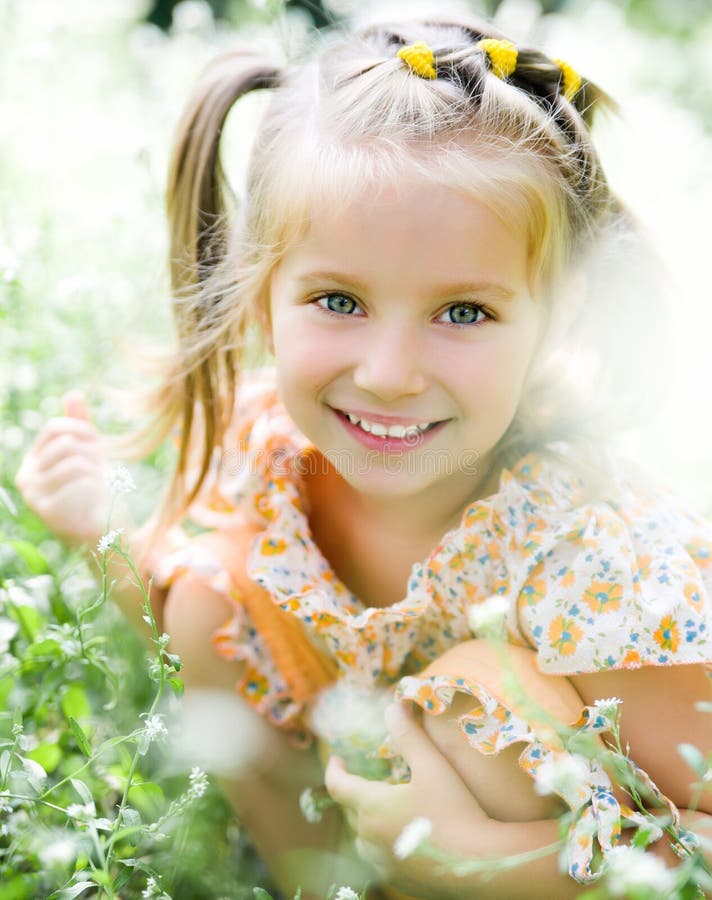 Beautiful Little Girl On The Meadow In Summer Day Face Close Up