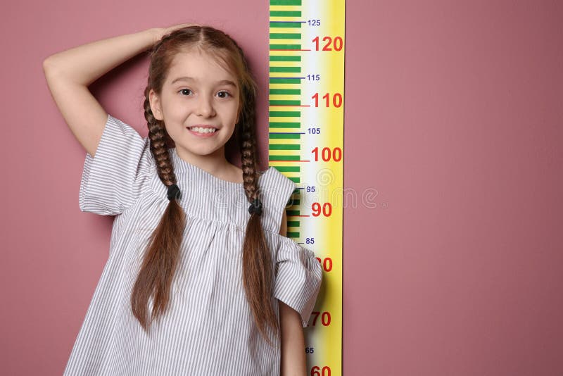 Little Girl Measuring Her Height Stock Image - Image of check, color:  115690887