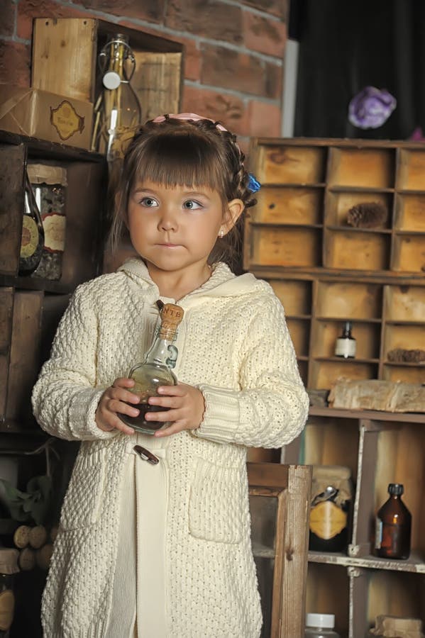 Little girl on the old kitchen