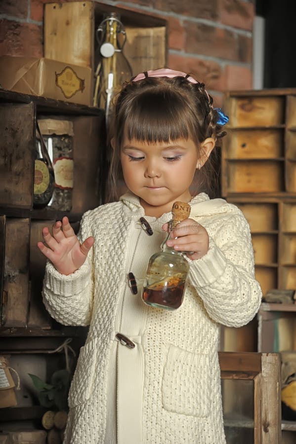 Little girl on the old kitchen