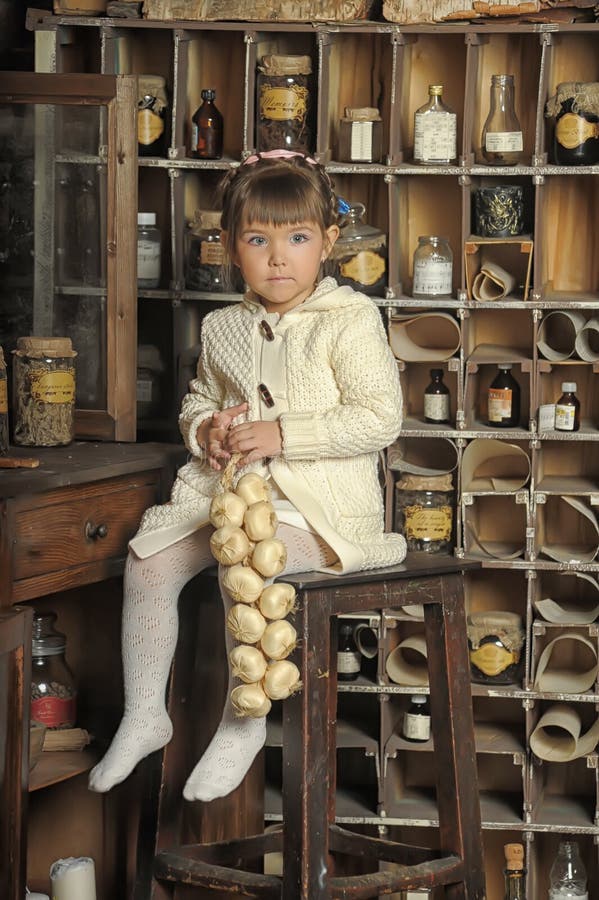 Little girl on the old kitchen