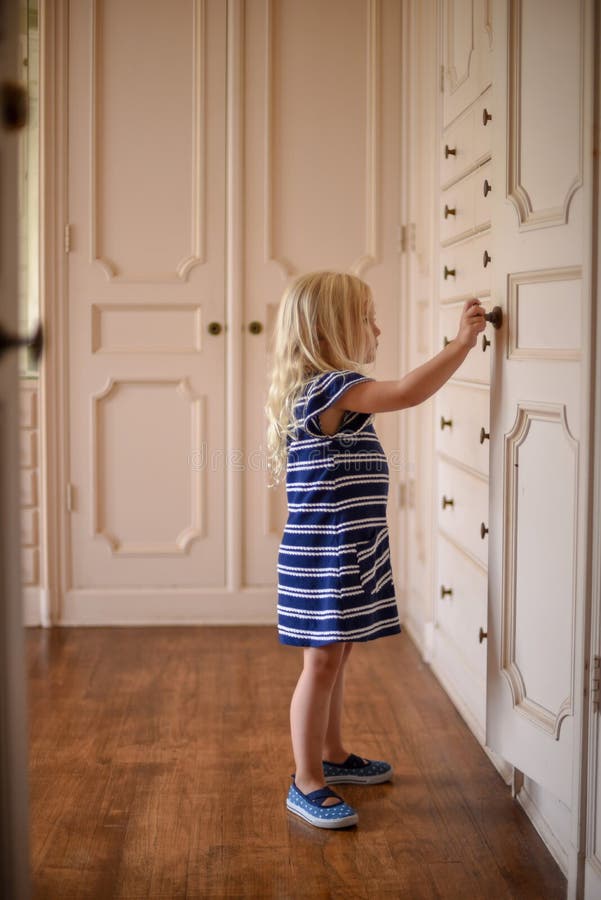 Child Opening Cabinet Stock Photos Download 22 Royalty Free Photos