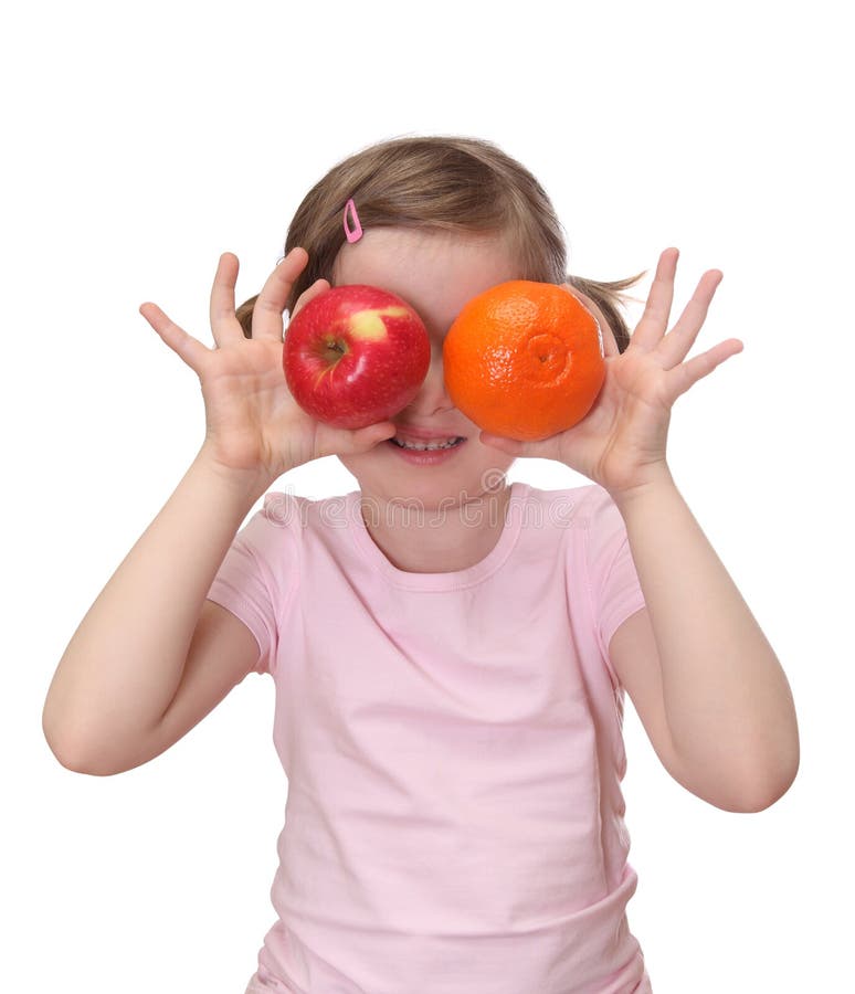 Little girl with orange and apple