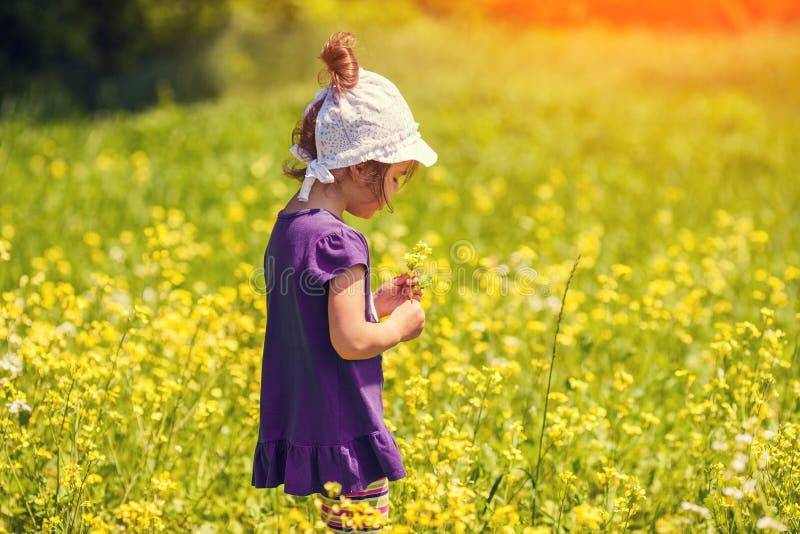Are you picking flowers at the moment. The girl is picking Flowers..