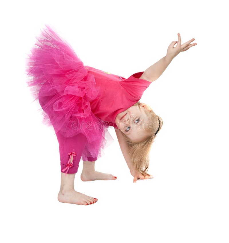 Little girl in a pink dress dancing