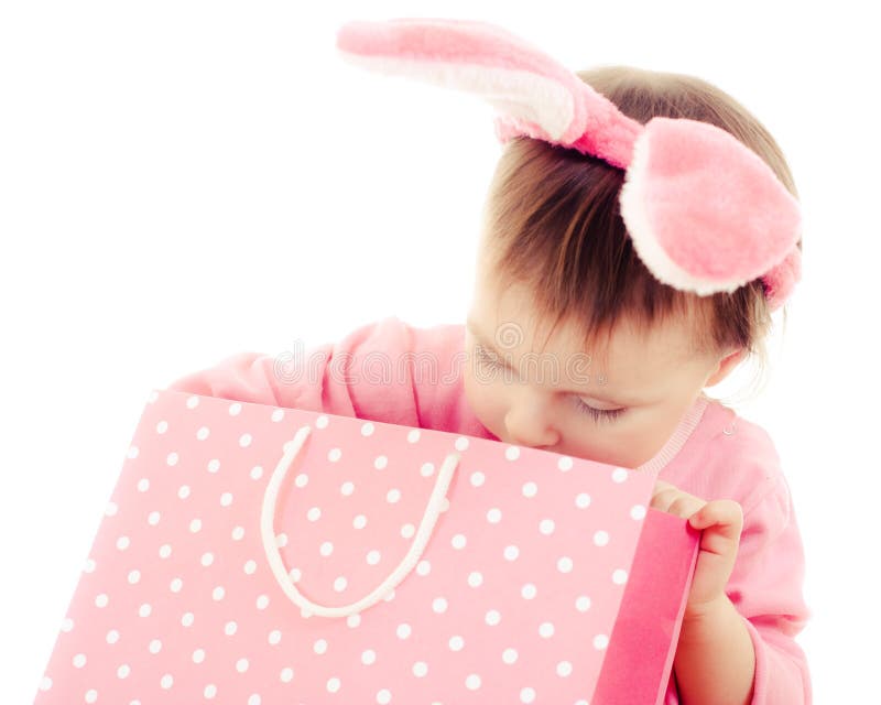 The little girl with pink ears bunny and bag.