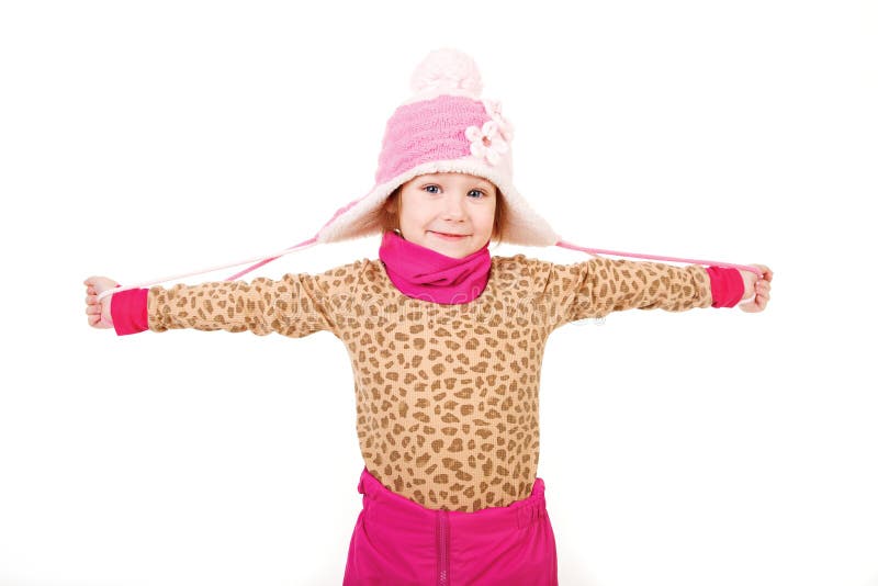 Little girl in a pink hat with arms outstretched