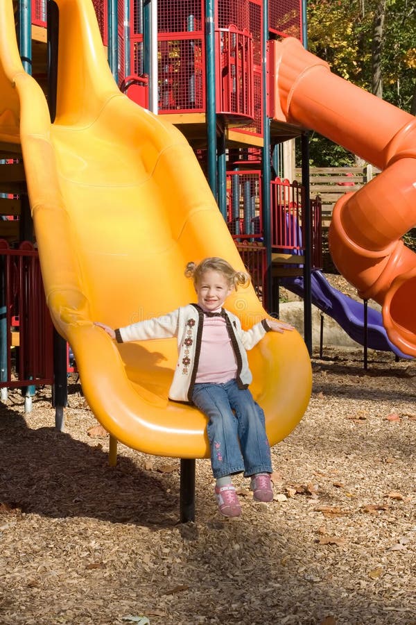 Little girl at playground. stock image. Image of slide 3579043