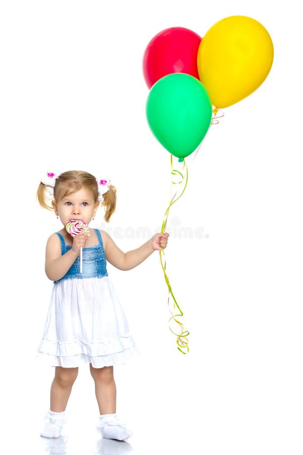 Little girl is playing with a balloon