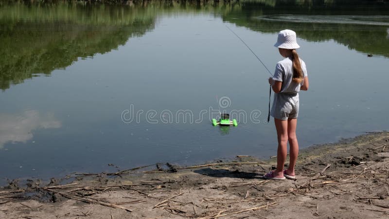 Little Girl Playing with Carp Fishing Bait Boat. Kid Fishing with Dad.  Child Near Dirty Water in the River Stock Footage - Video of bait, boat:  230671274