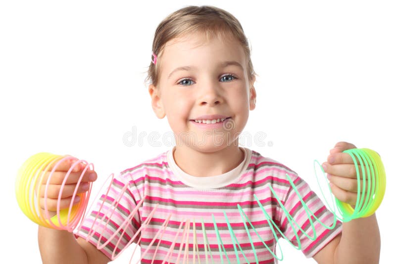 Little girl playing with colorful plastic spring stock image
