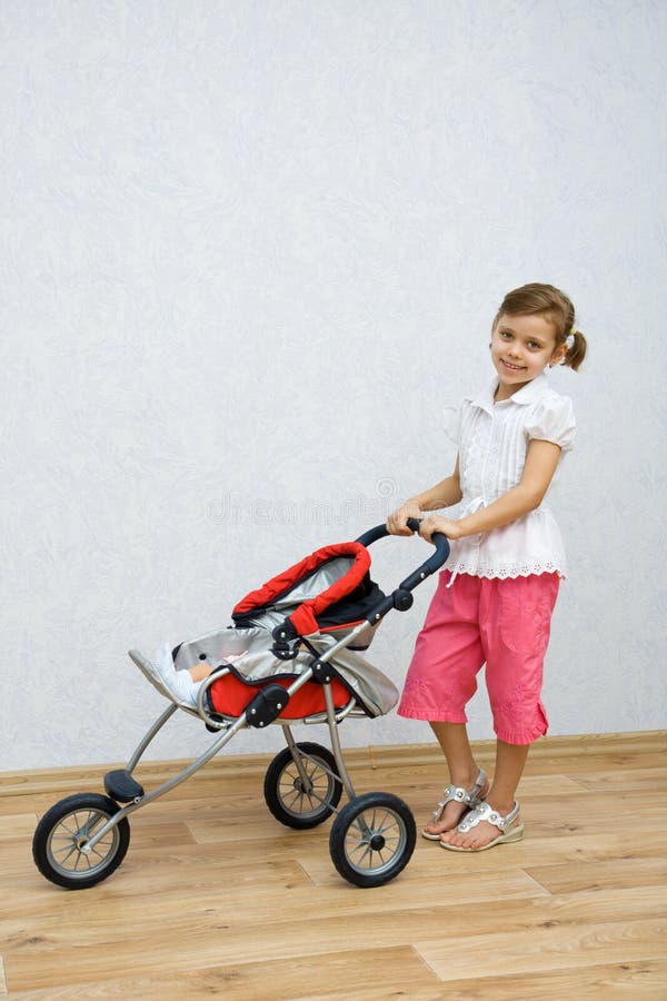 Little girl playing with doll royalty free stock images