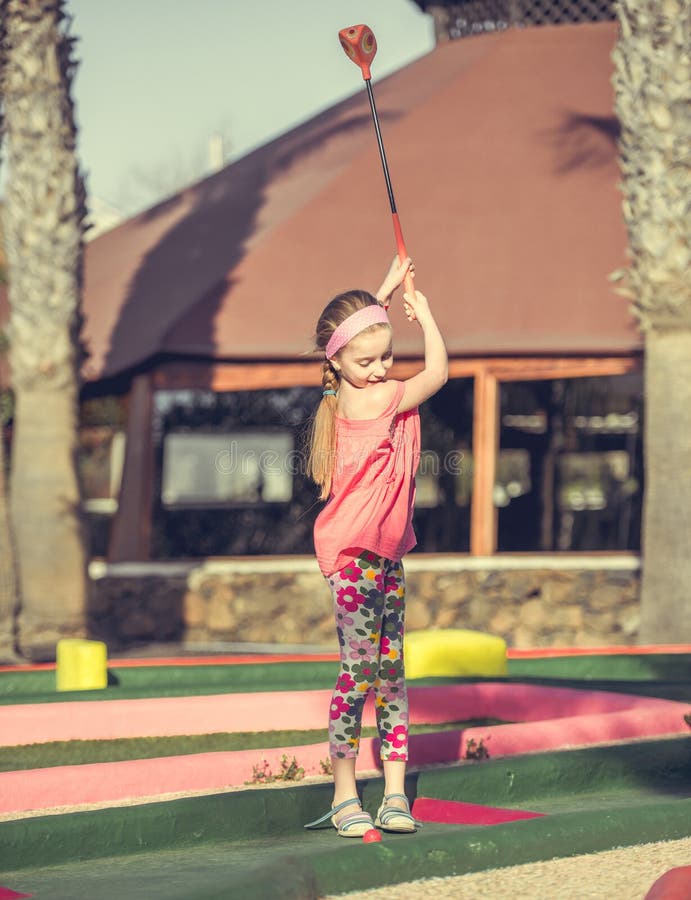 Little girl playing golf stock photo. Image of golfing 55110016