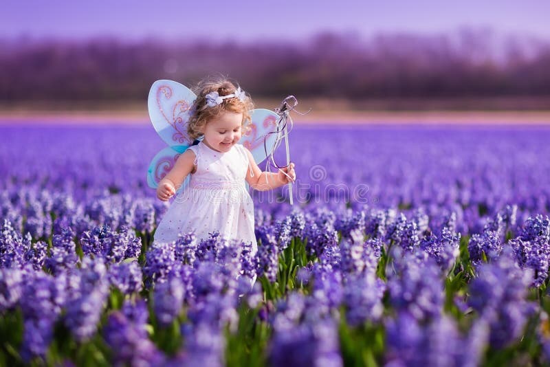 Little girl playing in hyacinth field