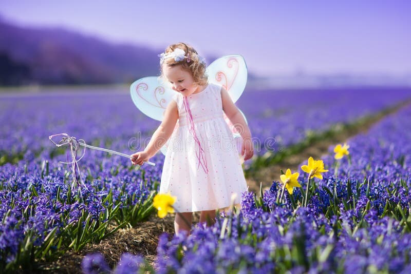 Little girl playing in hyacinth field