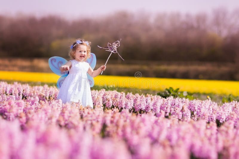 Little girl playing in hyacinth field