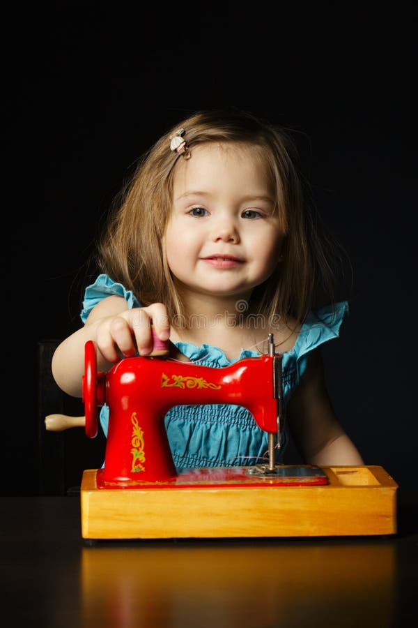 Little Girl is Playing with Sewing Machine Stock Photo Image of cute