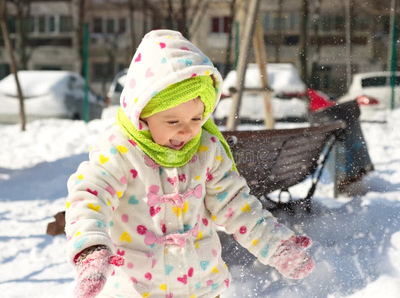 Little Girl Playing in the Snow Stock Image - Image of girl, cute ...