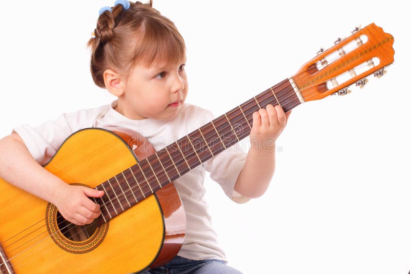 Girl Plays Guitar In Living Room