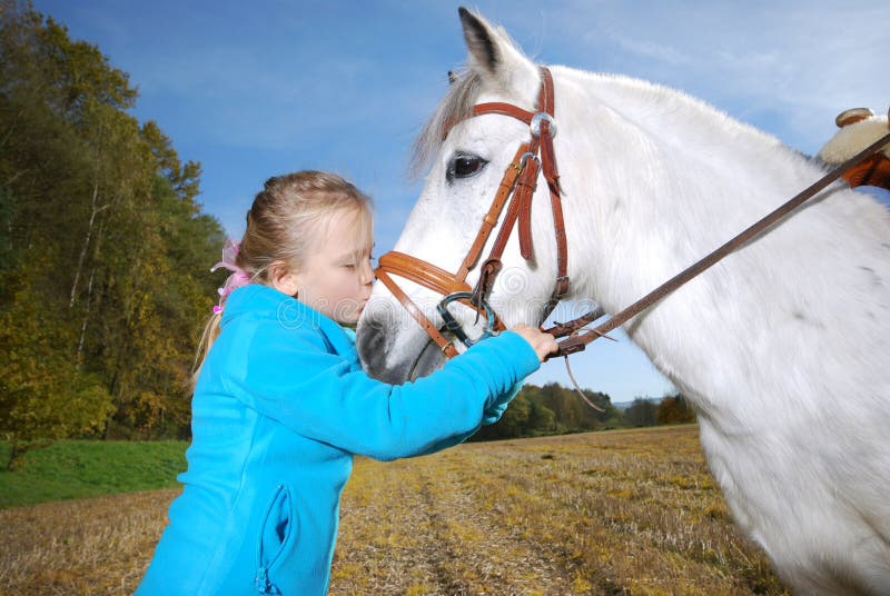 Little girl with pony