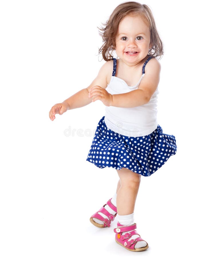 A little girl is posing