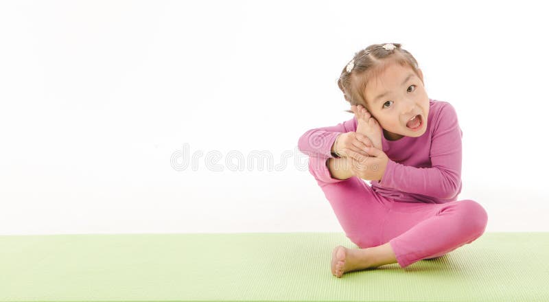 Cute little girl practice yoga Stock Photo - Alamy