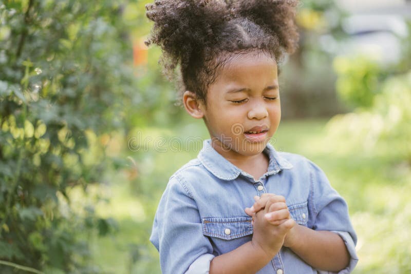 Little girl praying. kid prays. Gesture of faith.Hands folded in prayer concept for faith,spirituality and religion.