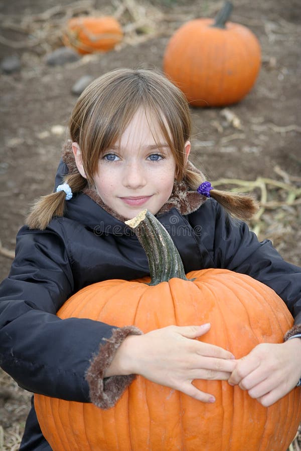 Little Girl in Pumpkin Patch