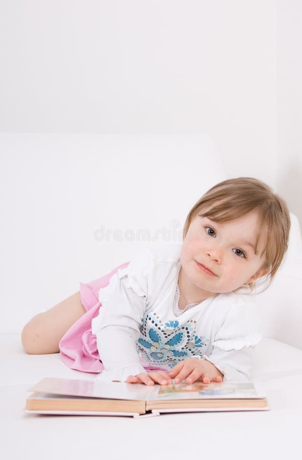 Little girl reading book