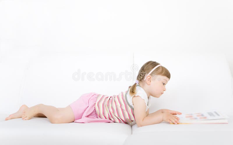 Little girl reading book