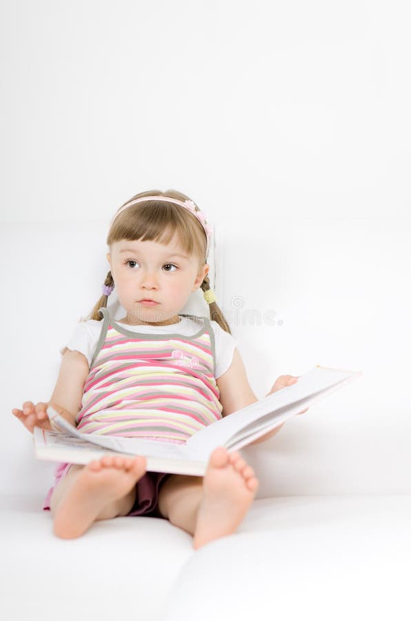 Little girl reading book