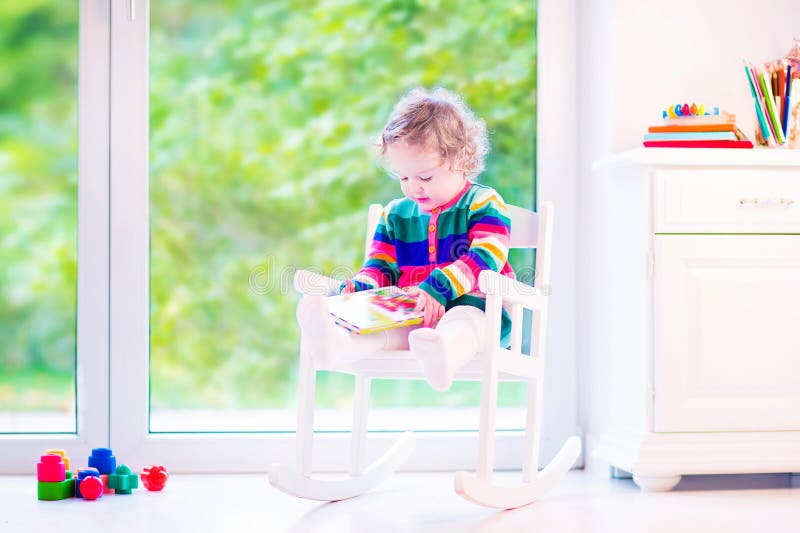 Little girl reading a book