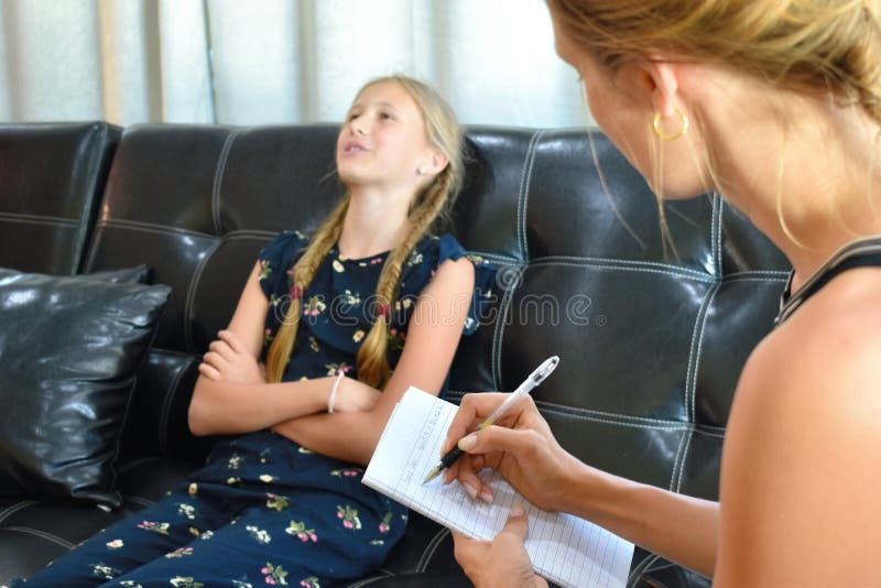 The little girl at the reception of a psychologist. A family therapist. Children`s mental therapy . royalty free stock photo The little girl at the reception of a psychologist. A family therapist. Children`s mental therapy . royalty free stock photo