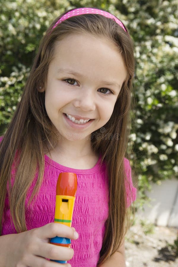 Little Girl Holding Flute Stock Photos - Free & Royalty-Free Stock ...