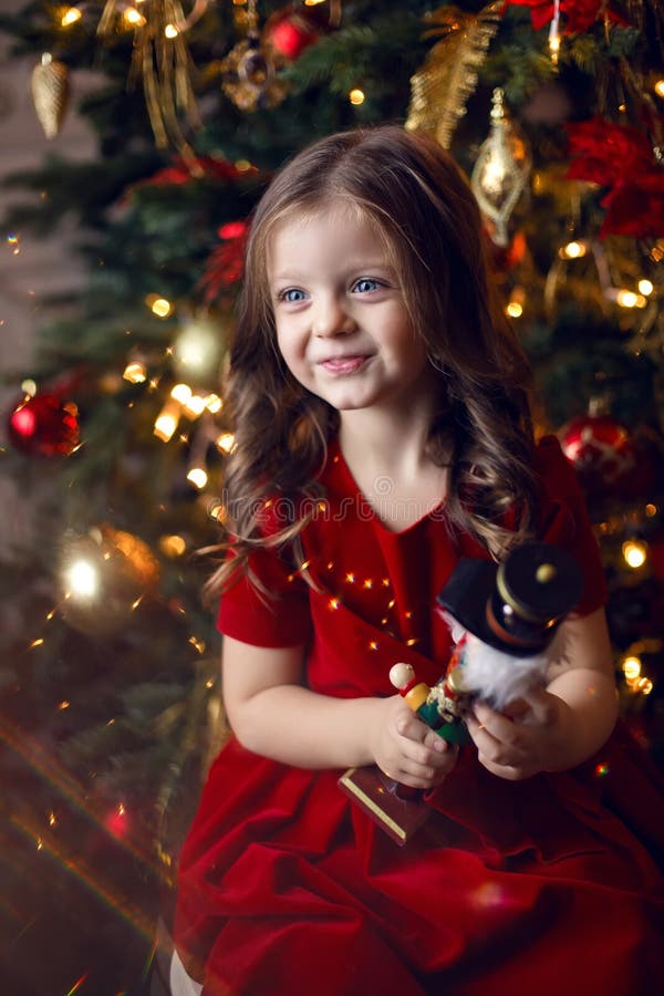 Little Girl in Red Dress Plays Stock Photo - Image of look, little ...