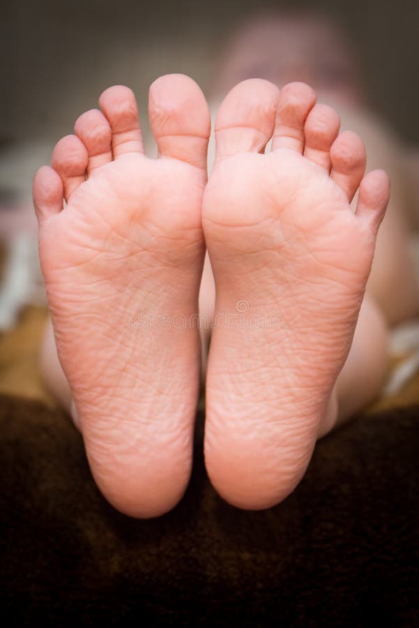 A little girl s bare feet