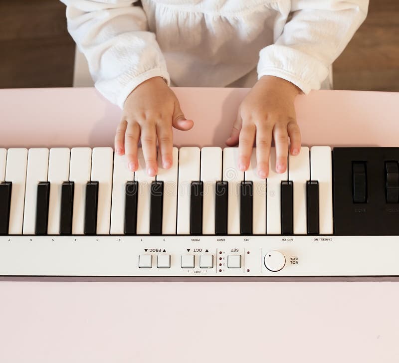 Little Girl's Hands Playing Electronic Piano Stock Photos Free & RoyaltyFree Stock Photos