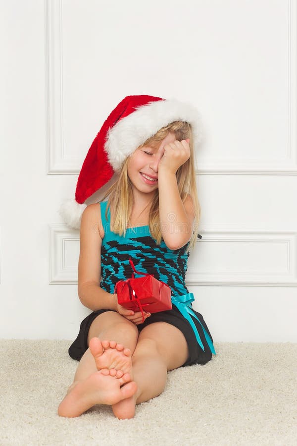 Little girl in the santa claus hat