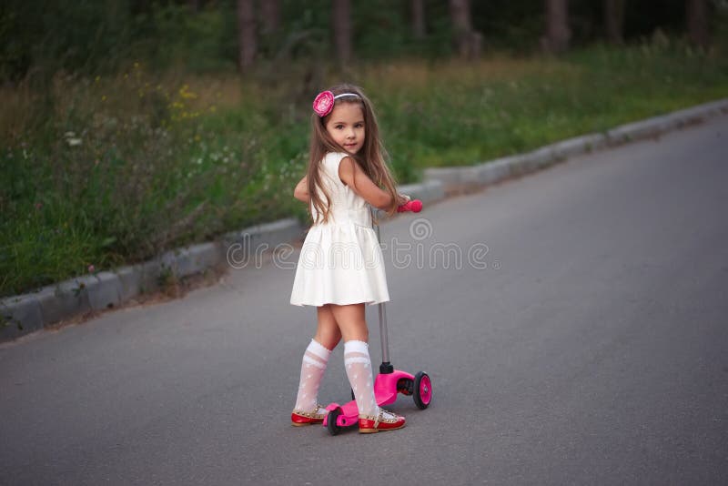 Little Girl with Scooter on the Road Stock Photo Image of beauty