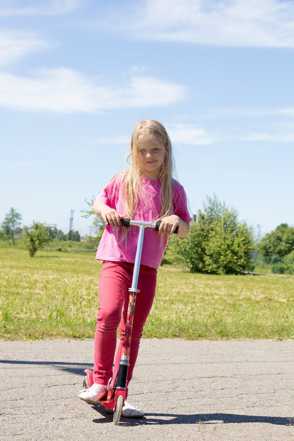 Little girl with scooters stock image. Image of sport 27787643