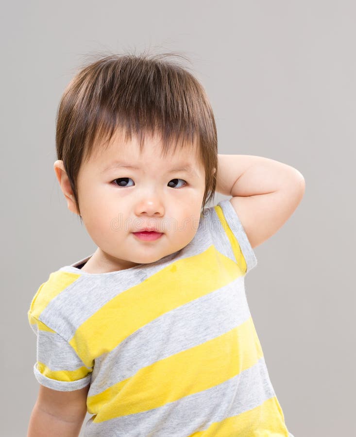 Little girl scratching stock image. Image of cute, cheek 26156671