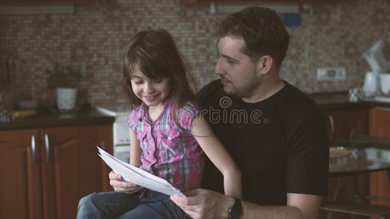 Little Girl Shows Her Drawings To Her Dad. Father and Daughter Together Stock Video - Video of parenting, home: 90503671