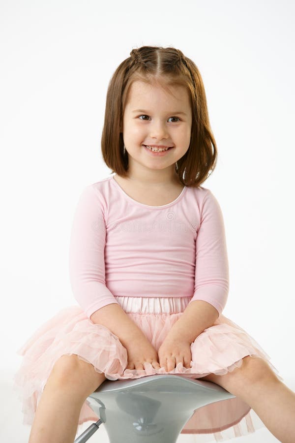 Little girl sitting on chair