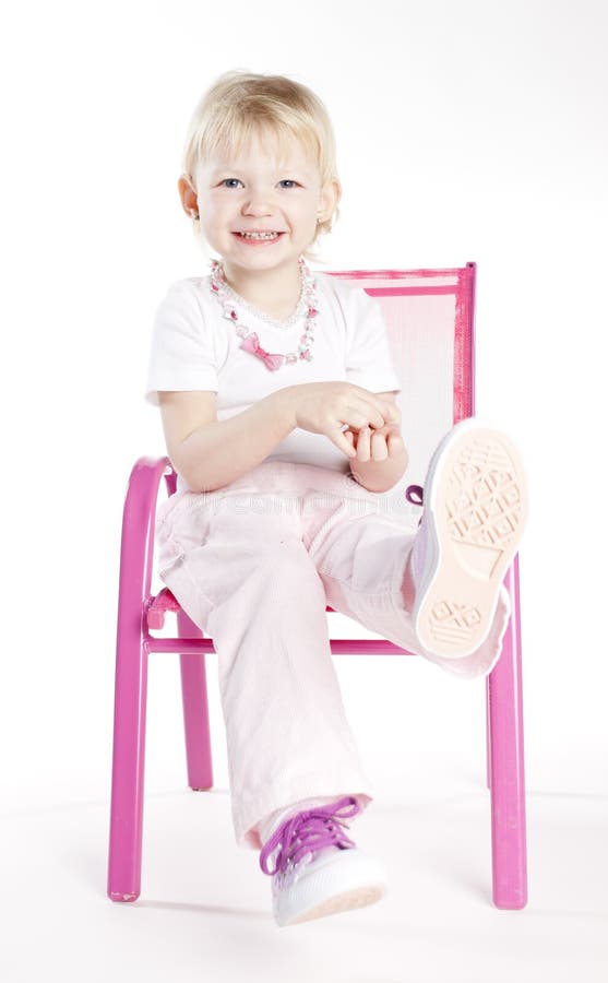 Little girl sitting on chair