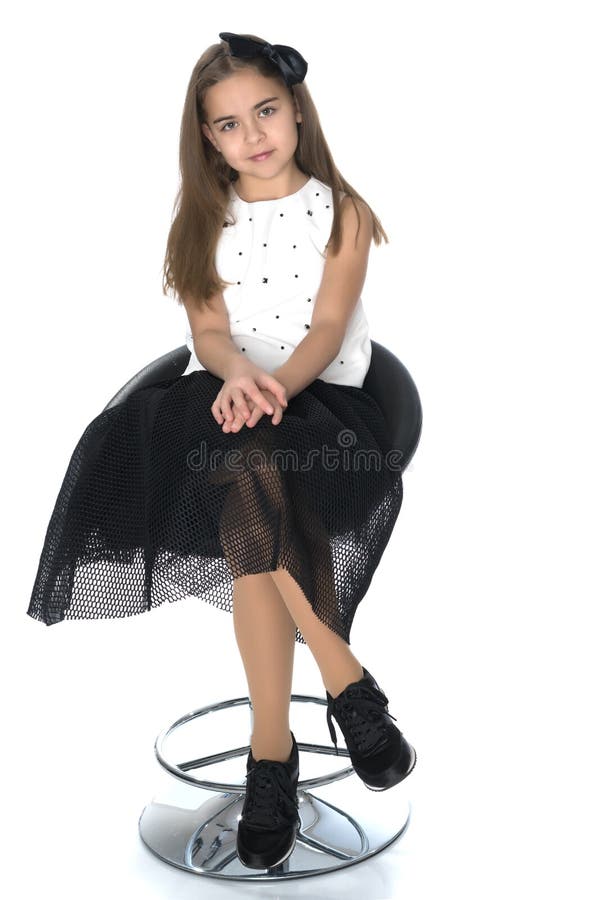 Little Girl is Sitting on a Chair Stock Photo - Image of looking, happy ...