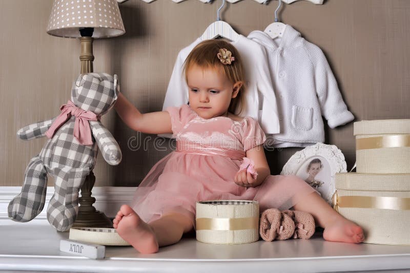Little Girl Sitting On The Dresser Stock Image Image Of Dress
