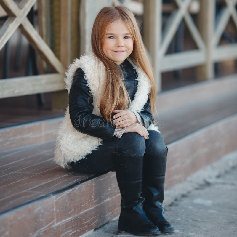 Little Girl Sitting on the Steps Near the House. Stock Photo - Image of ...