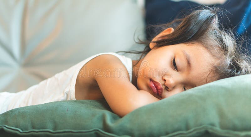 The Little Girl is Sleeping on the Bed Stock Photo - Image of bear ...
